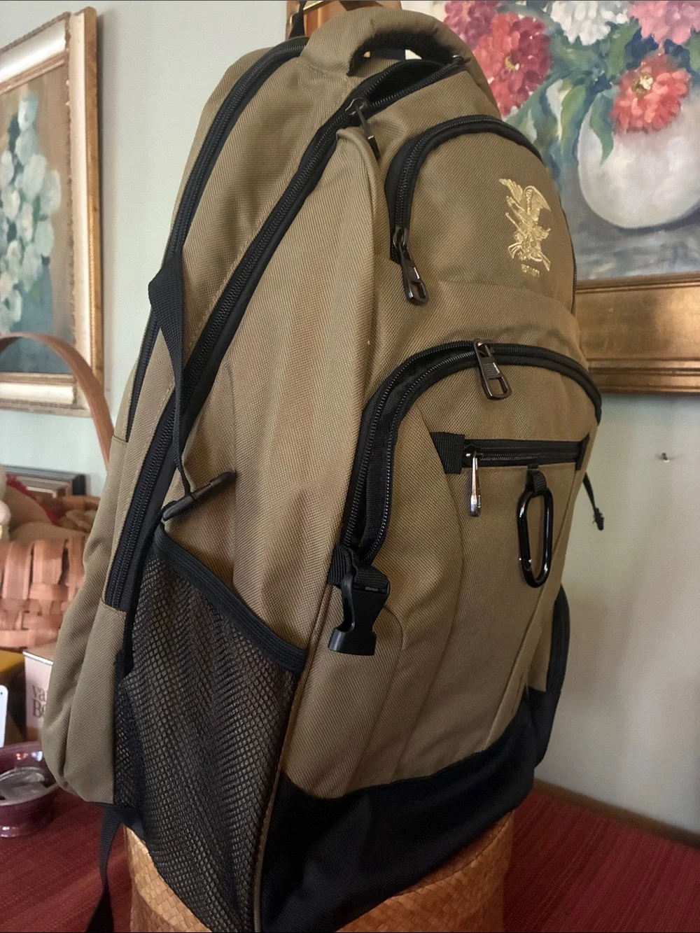 NRA Tactical Backpack Multi-Pocket in tan with black accent panels, EST 1871